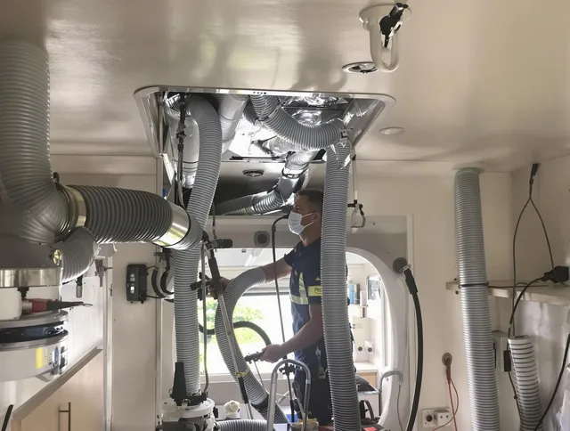Raynham Air Duct Cleaning specialist performing precise mobile home duct cleaning in Raynham