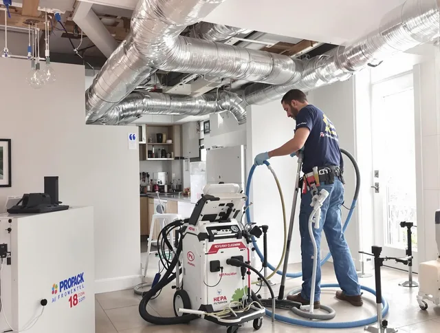 Raynham Air Duct Cleaning technician performing advanced pure duct cleaning with specialized equipment in Raynham