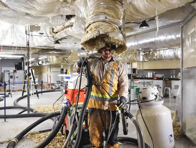 Professional vacuum insulation removal by Raynham Air Duct Cleaning expert in Raynham